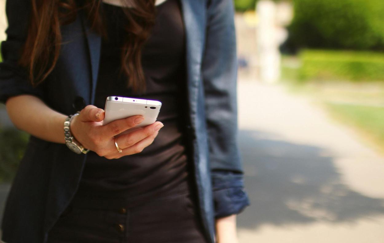 Person holding a mobile phone