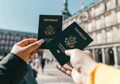 Global Engagement - Two people holding passports 